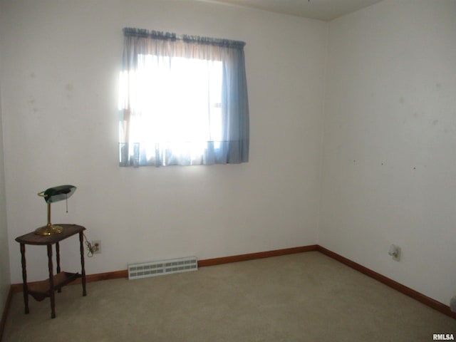 spare room featuring carpet flooring