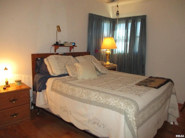 bedroom with wood-type flooring