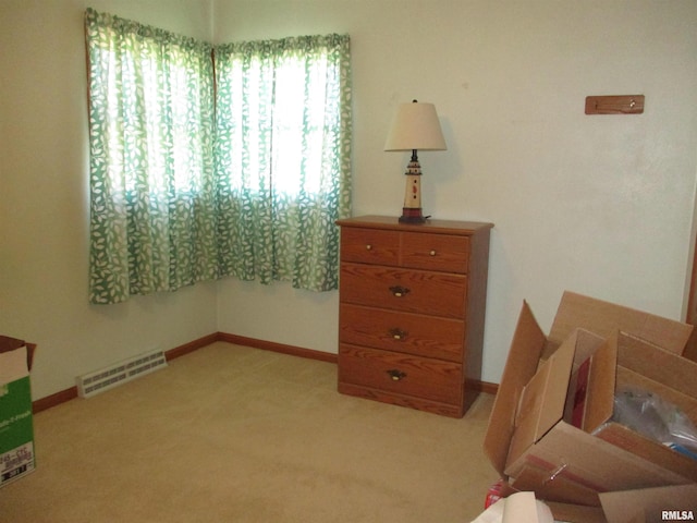 bedroom with light carpet