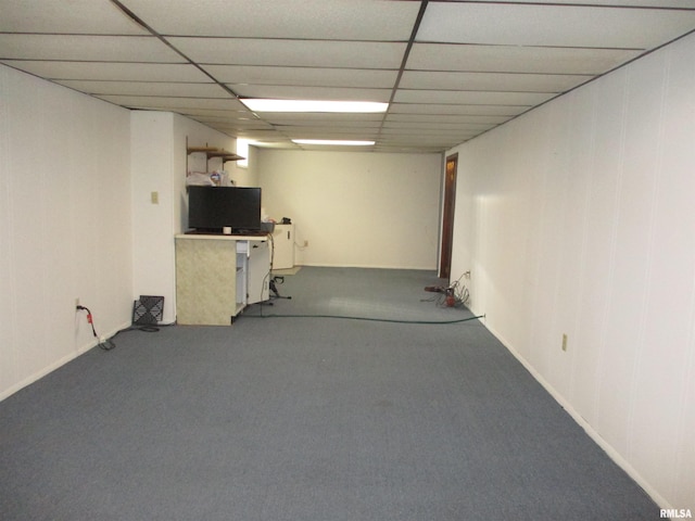 basement with a paneled ceiling