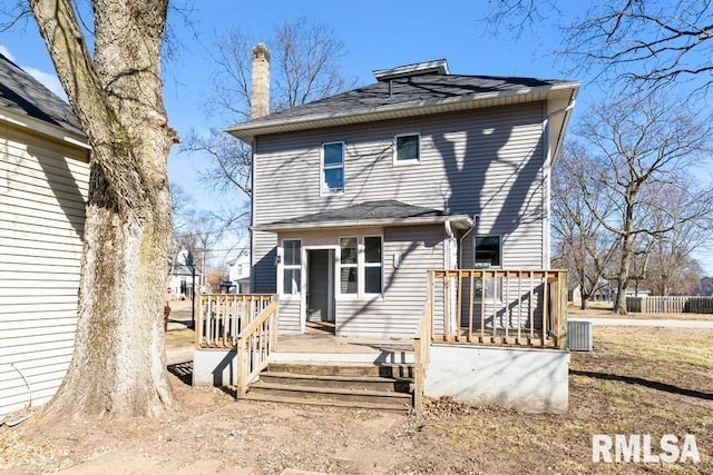 rear view of property with a wooden deck