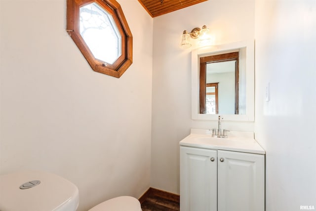 bathroom featuring vanity and toilet