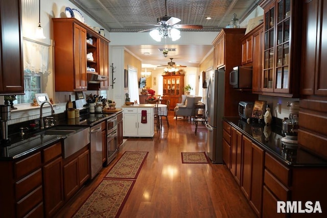 25065 Rock Springs Hollow Rd, Thebes, IL 62990 - kitchen featuring a ceiling fan, appliances with stainless steel finishes, dark wood-style floors, glass insert cabinets, and under cabinet range hood
