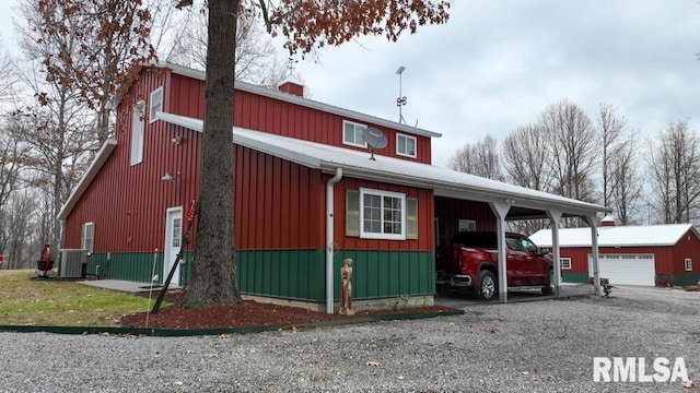 25065 Rock Springs Hollow Rd, Thebes, IL 62990 - exterior space featuring a garage, an outbuilding, central AC, and driveway