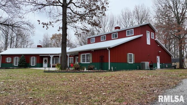 25065 Rock Springs Hollow Rd, Thebes, IL 62990 - traditional-style home with a front lawn, central air condition unit, and a chimney