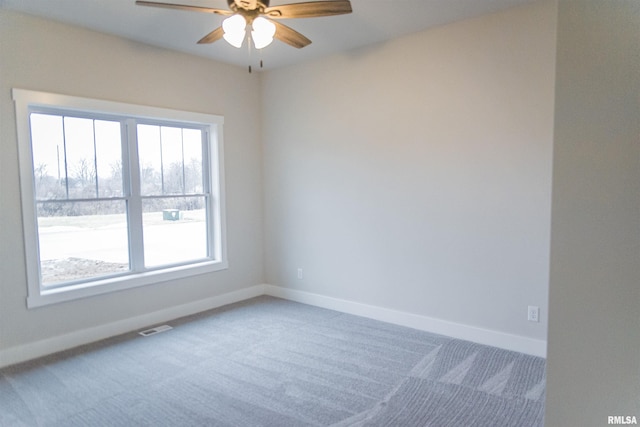 unfurnished room featuring carpet flooring and ceiling fan