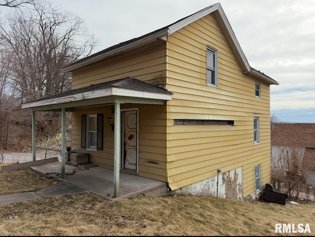 back of house with a patio area