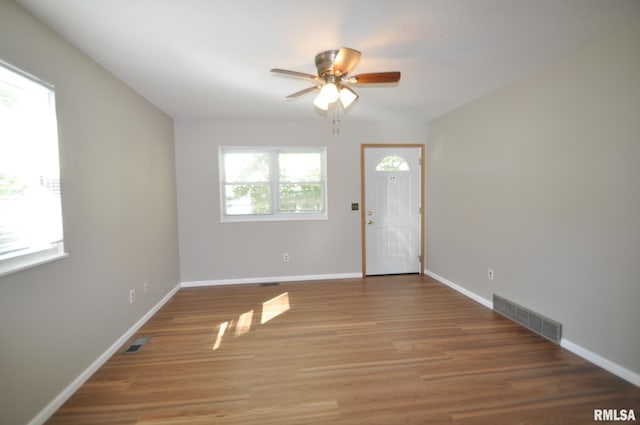 interior space featuring hardwood / wood-style floors and ceiling fan