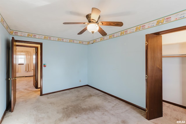 unfurnished bedroom with light carpet, a closet, and ceiling fan