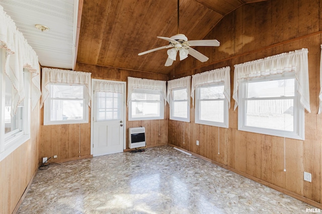 unfurnished sunroom featuring vaulted ceiling, a healthy amount of sunlight, heating unit, and wood ceiling