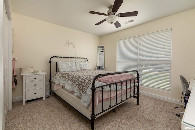 carpeted bedroom with ceiling fan