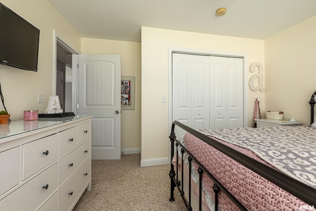 carpeted bedroom with a closet