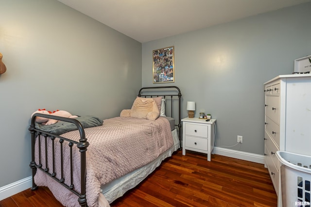 bedroom featuring dark wood-type flooring