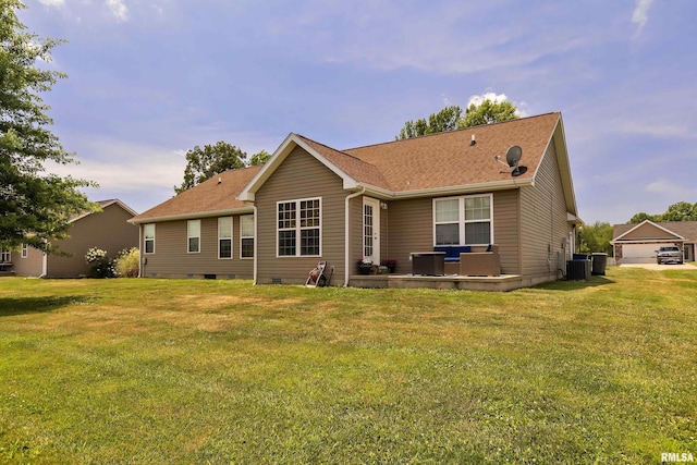 back of property with cooling unit and a yard