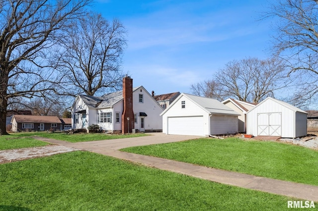 view of front of home with a shed and a front lawn