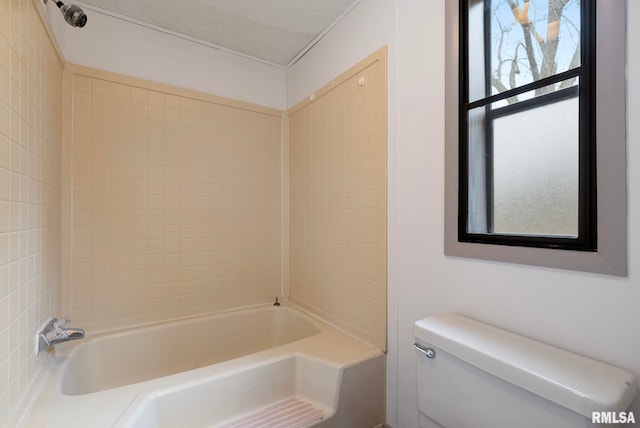 bathroom with toilet and tub / shower combination