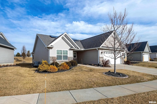 view of front of property with a garage and a front yard