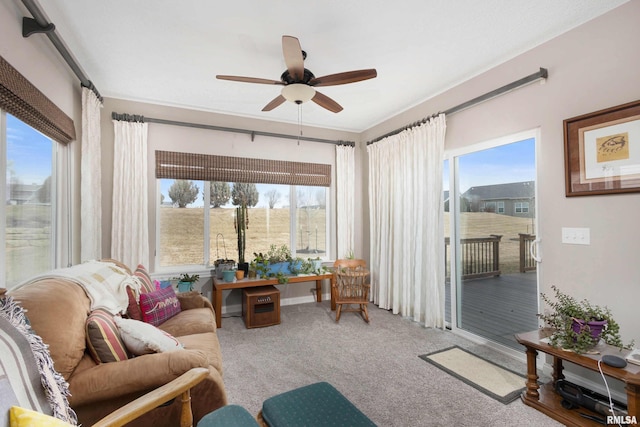 sunroom / solarium with ceiling fan