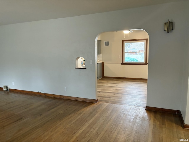 unfurnished room featuring wood-type flooring