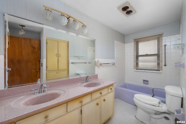 bathroom featuring vanity, tile walls, tile patterned floors, and toilet