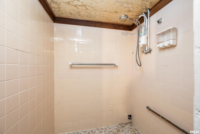 bathroom with tiled shower