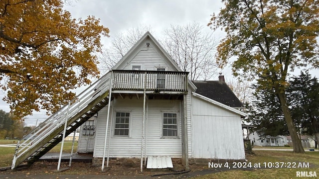 rear view of house with a balcony