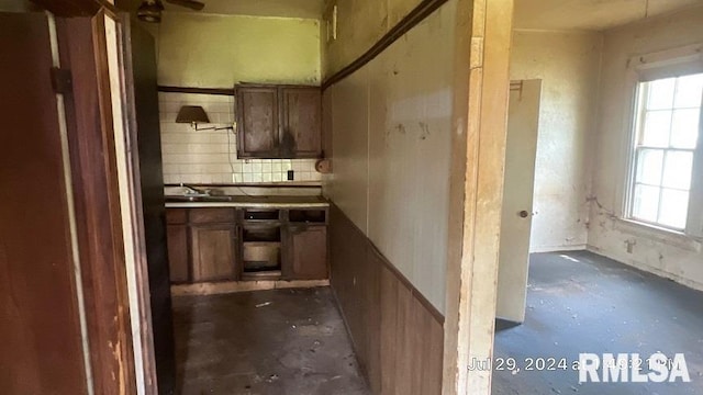 kitchen featuring tasteful backsplash and sink