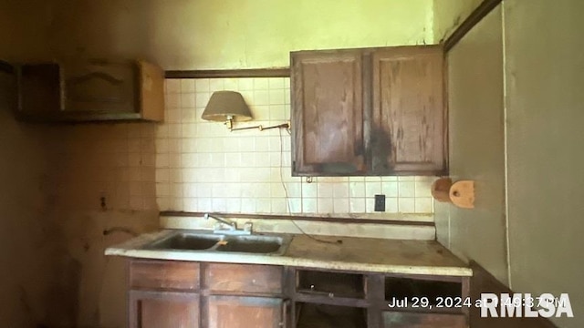 kitchen featuring sink and backsplash