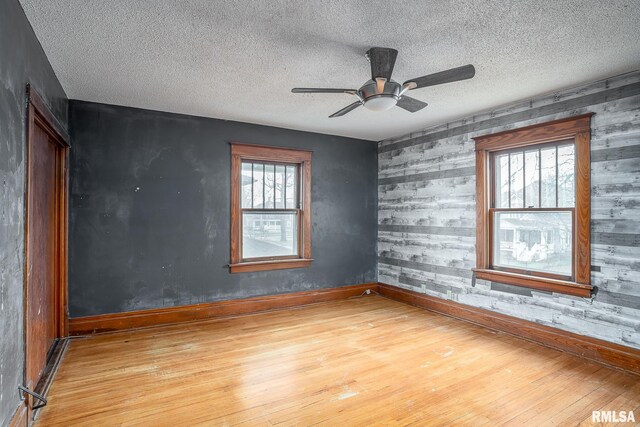 interior details featuring a brick fireplace, crown molding, and wood-type flooring