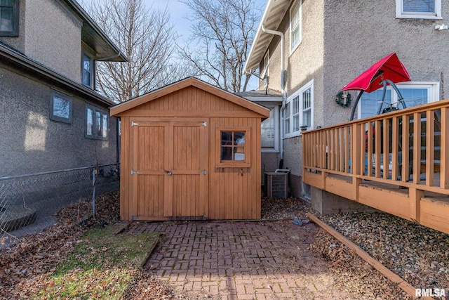 view of outdoor structure with central AC