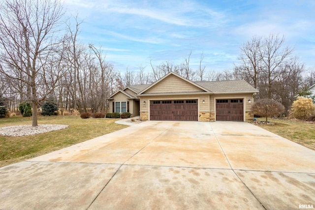 single story home featuring a garage and a front yard