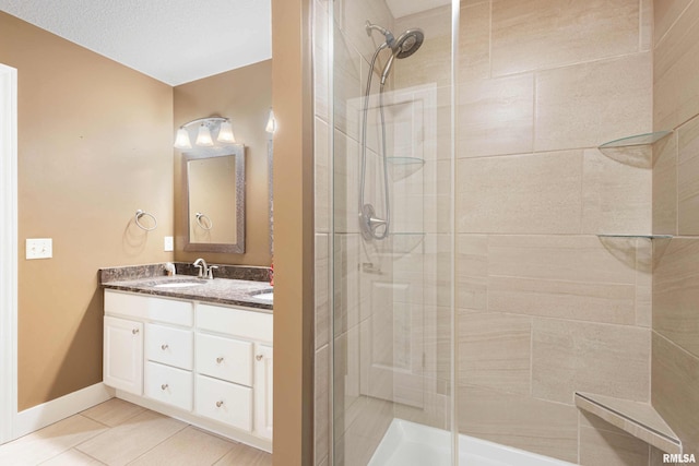 bathroom featuring vanity, an enclosed shower, and tile patterned flooring