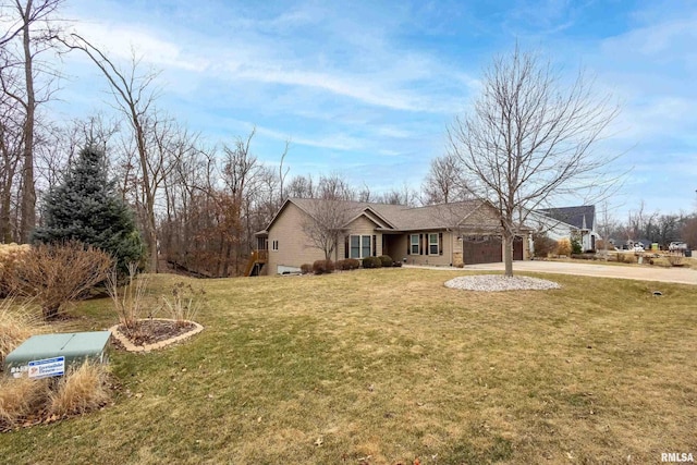 ranch-style home featuring a garage and a front lawn