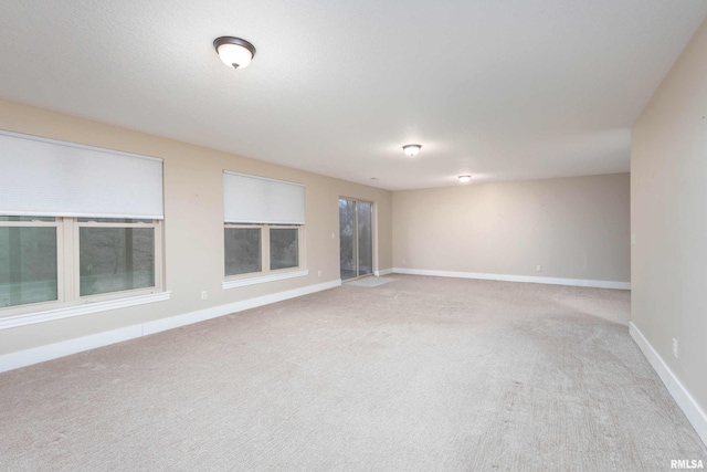 empty room featuring light colored carpet