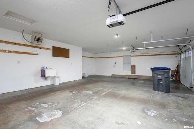 garage featuring a garage door opener and sink