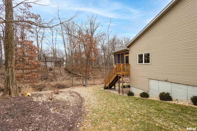 view of yard featuring a sunroom