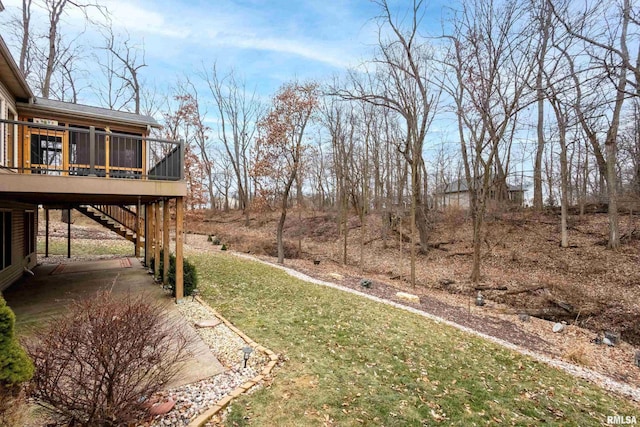 view of yard with a wooden deck