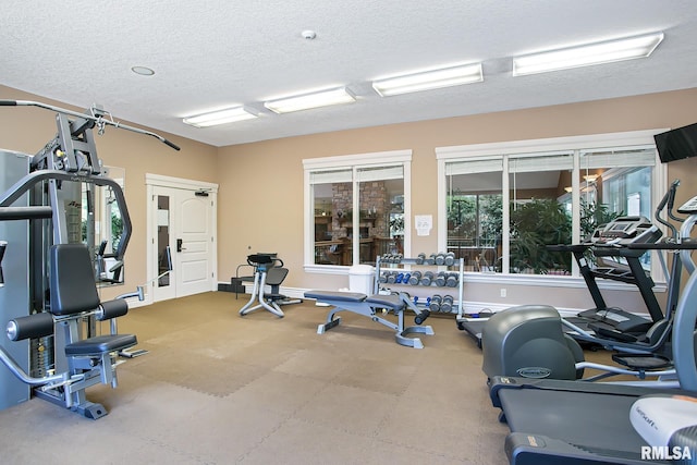 gym with a textured ceiling