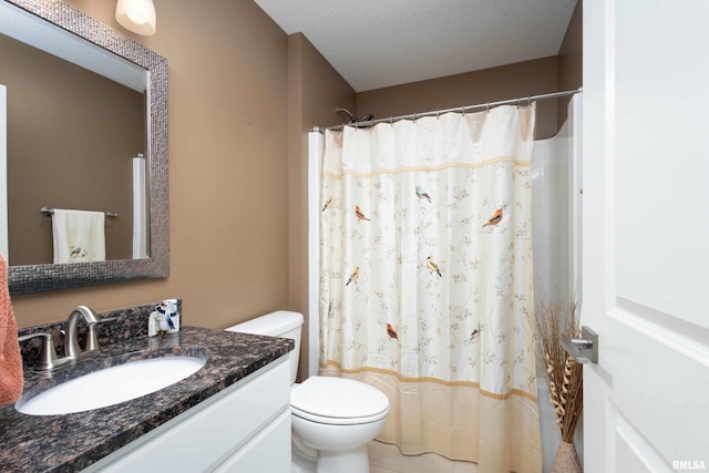 bathroom with vanity, walk in shower, toilet, tile patterned floors, and a textured ceiling