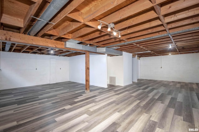 basement with wood-type flooring