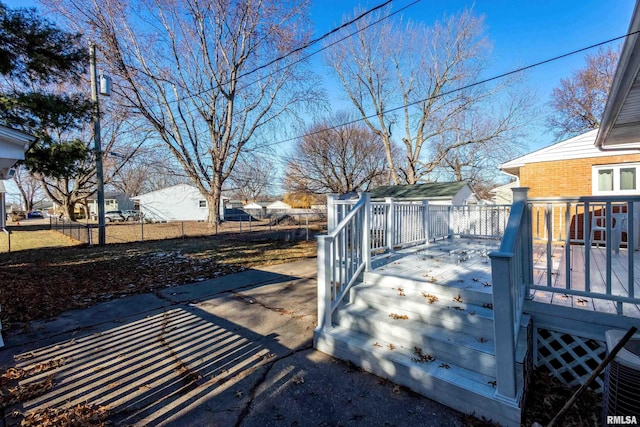 wooden deck featuring central air condition unit