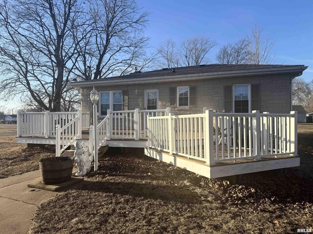 back of house featuring a deck