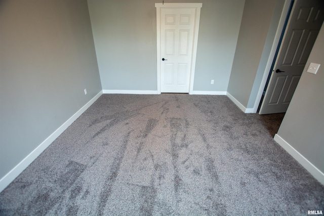 empty room featuring carpet flooring