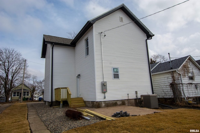 view of home's exterior with central AC unit