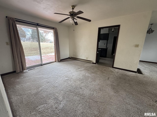 carpeted empty room with ceiling fan and baseboard heating