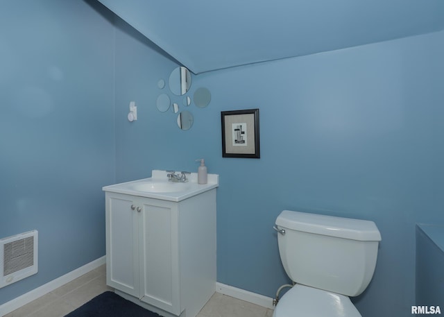 bathroom featuring vanity, toilet, and heating unit