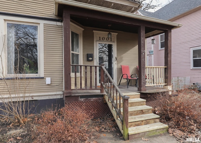 entrance to property featuring covered porch