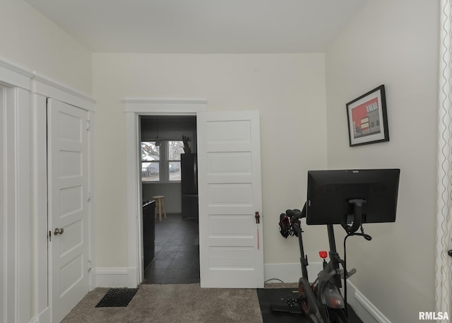 exercise room with dark carpet