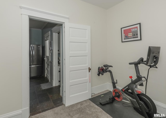 workout area with dark colored carpet