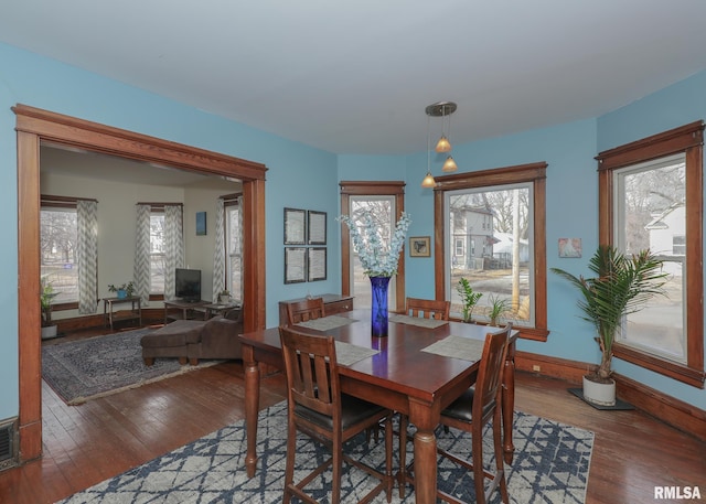 dining room with hardwood / wood-style floors